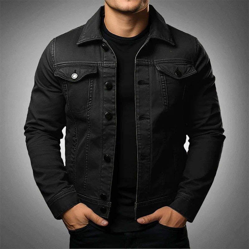 Black denim jacket worn by a person on a gray background