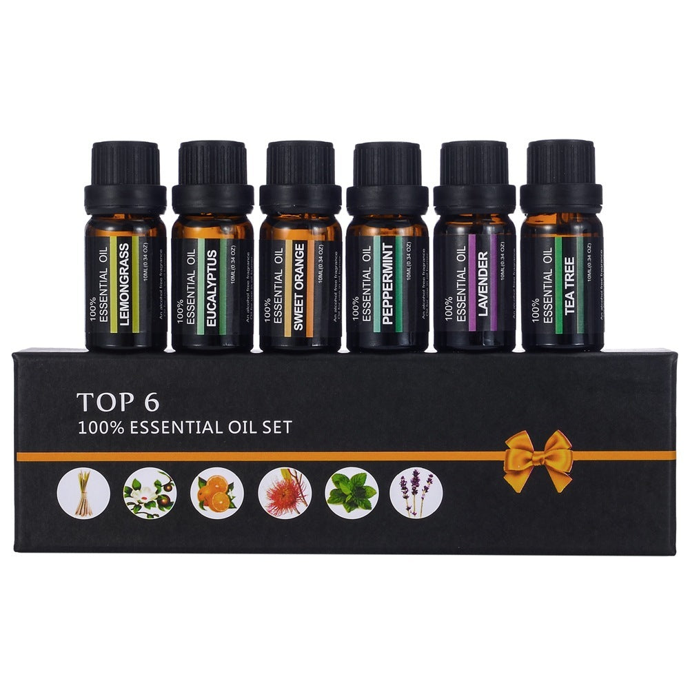 Set of six essential oil bottles with a black box labeled 'Top 6 100% Essential Oil Set' on a white background.