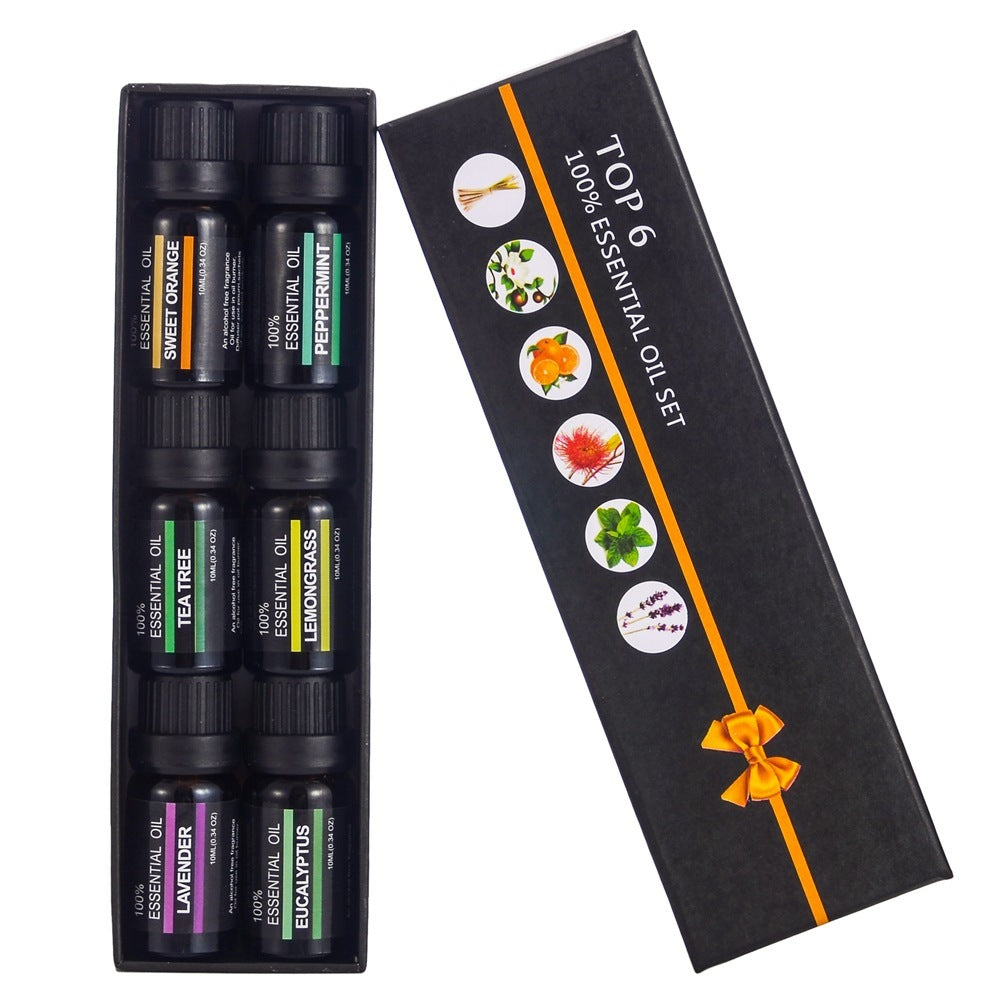 Set of essential oils with a decorative box on a white background