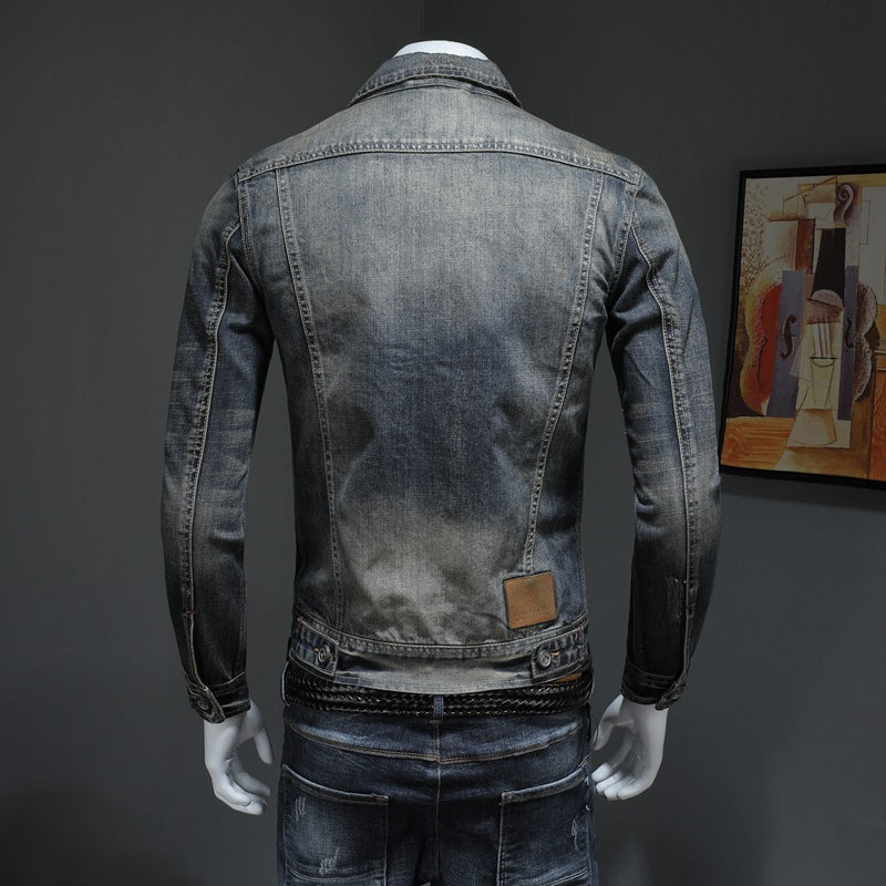 Denim jacket on a mannequin against a dark background