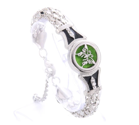 Silver bracelet with a green emblem on a white background