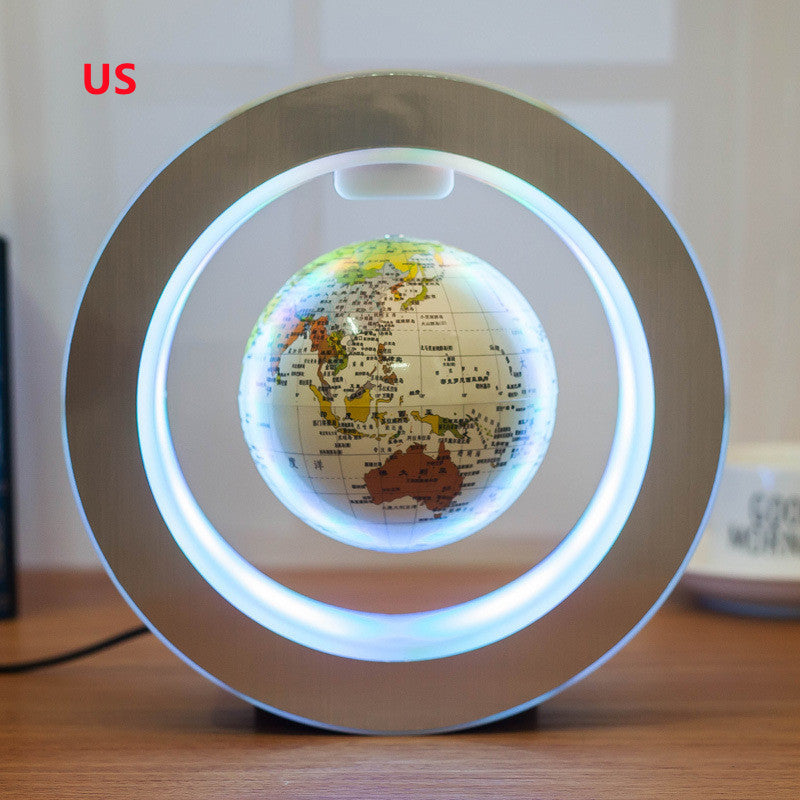 Levitating globe with LED lights on a wooden surface
