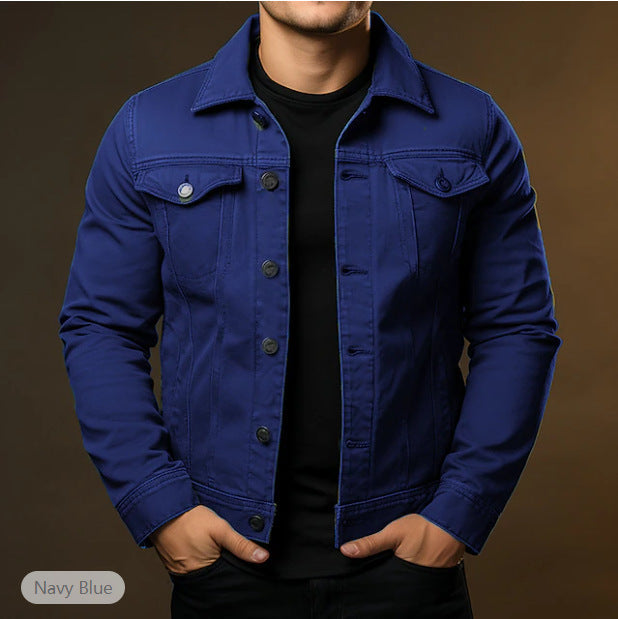 Navy blue denim jacket worn by a person on a brown background