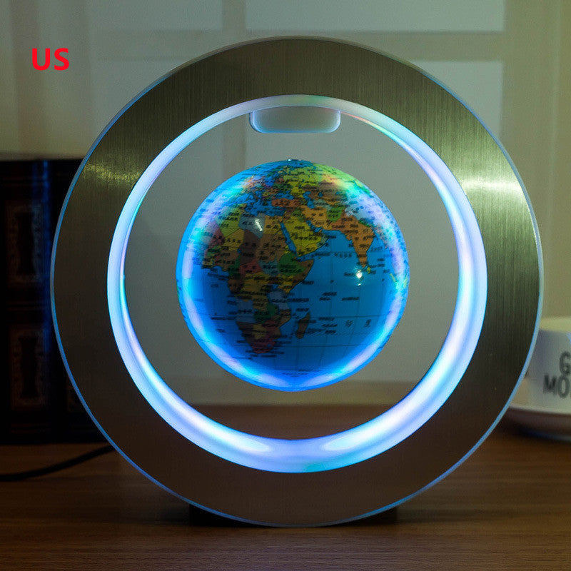 Magnetic悬浮地球仪 with LED light on a wooden surface