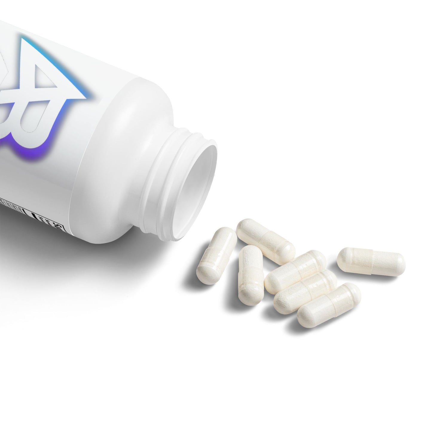 White supplement bottle with pills spilling out on a white background