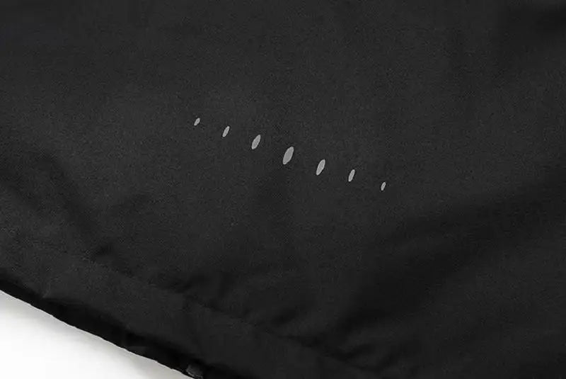Close-up of a black fabric surface with small white dots.