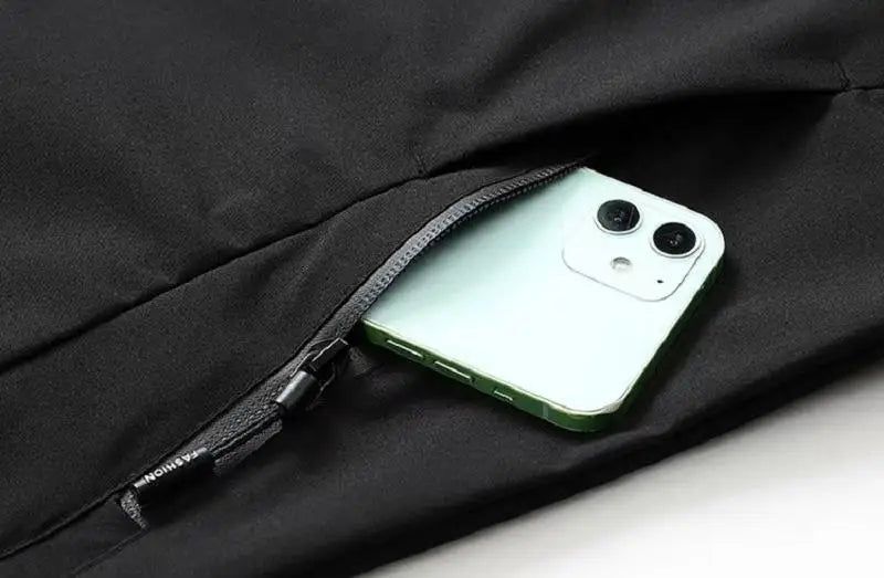 Green phone in a black pocket with a zipper