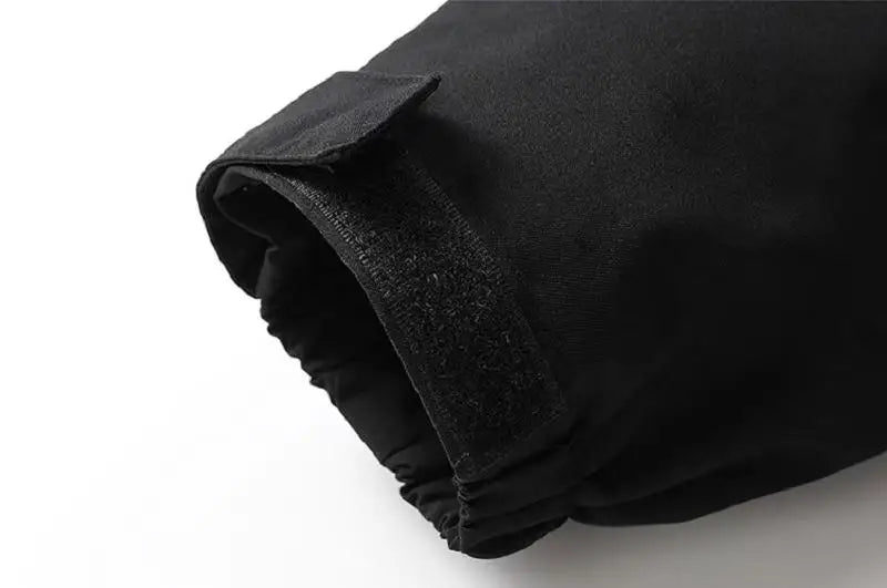 Close-up of a black fabric with a textured edge on a white background