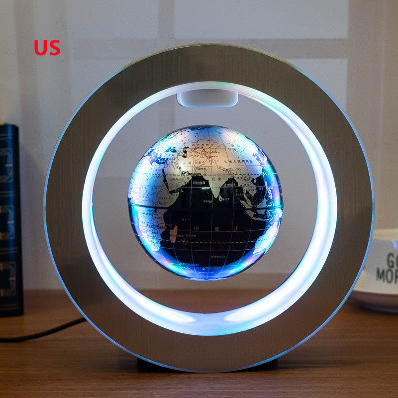 Levitating globe with LED lights on a wooden surface