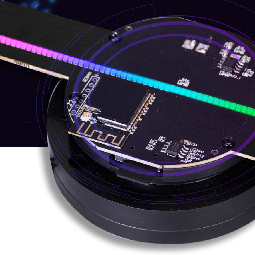 Close-up of electronic components on a black surface with a dark background