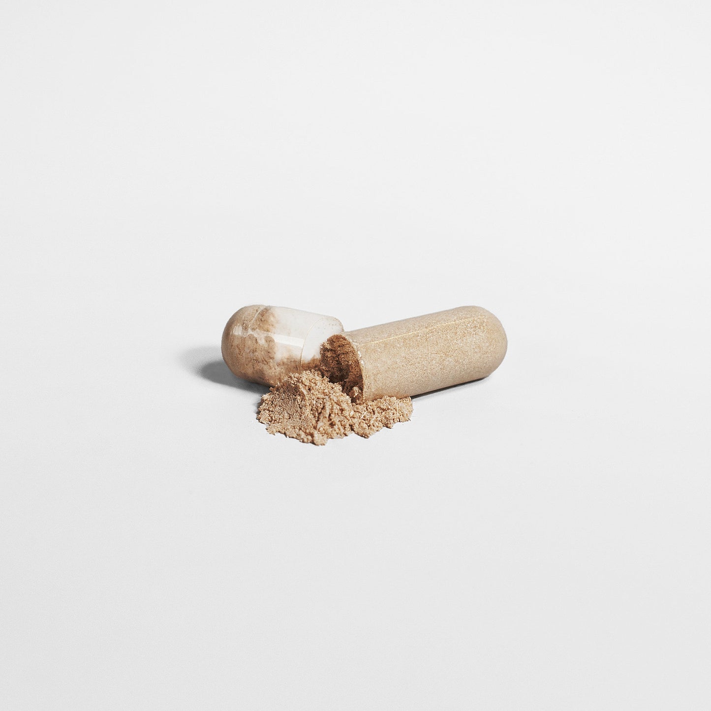 Wooden pestle and mortar on a white background