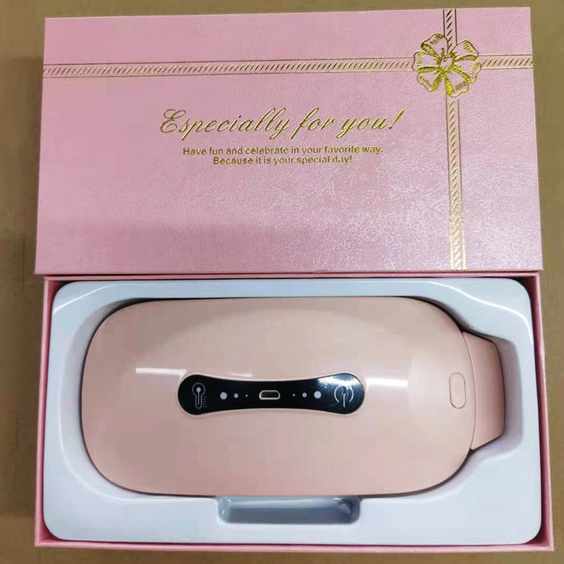 Pink electronic device in a decorative box with a bow and text.